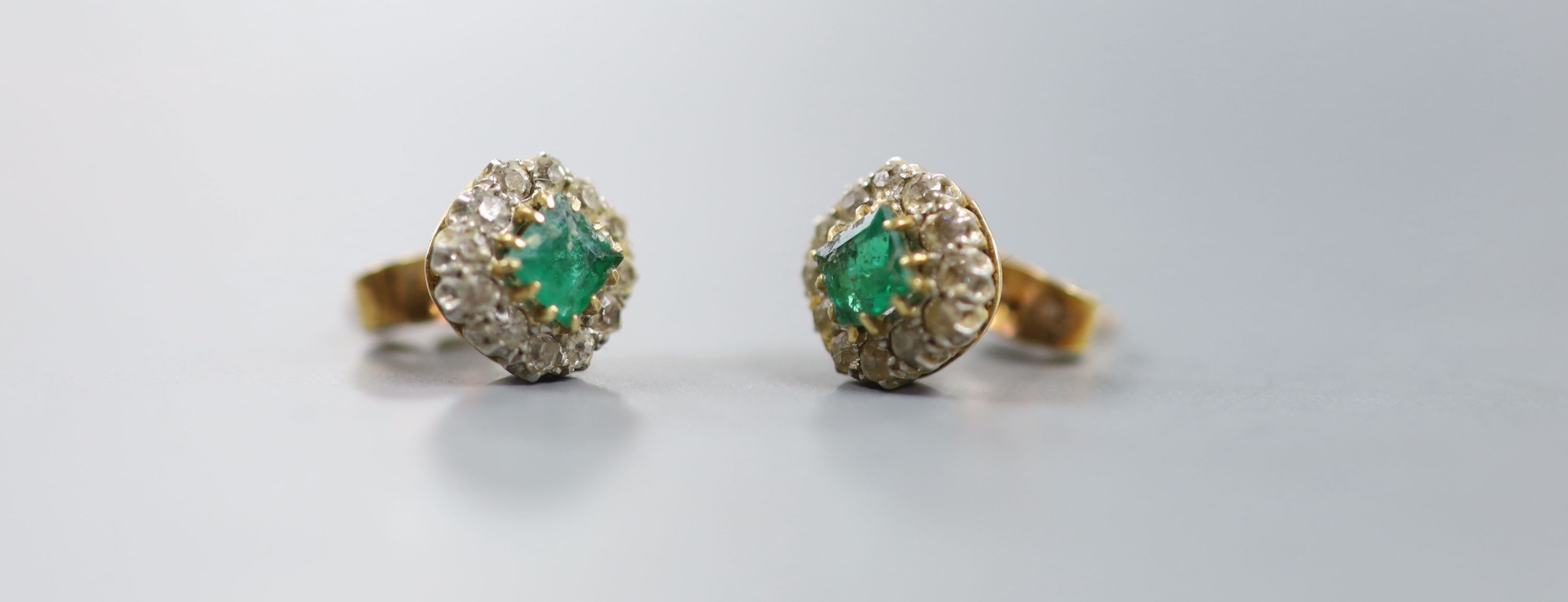 A pair of 18ct, emerald and diamond set octagonal cluster ear studs, 8mm, gross weight 3.2 grams.